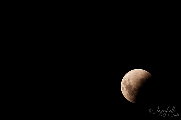 111210 Lunar Eclipse The moon moving into the shadow of the earth (1 of 2) copy