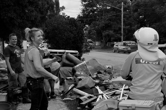 14.1.2011 Residents of Bulimba laugh as the mail is hand delivered BW